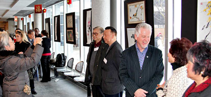 Durham College staff, faculty, students, and special guests attending a students art exhibit