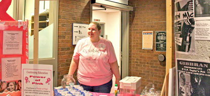 Kim MacPherson running a lemonade stand at 6th annual Power of Pink Breast Cancer Awareness Day