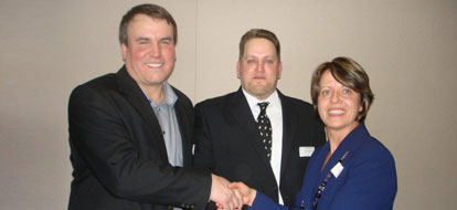 Darren Pascoe and Shawn Payette shake hands with Susan Todd after winning Walkerton Clean Water Centre award
