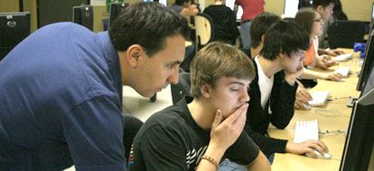 Professor Matt Grabinksy teaching high school students how to use Maya animation software