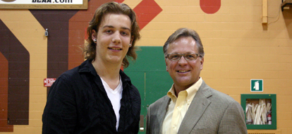Jordan Edwards, a student from Henry Street High School, poses with Don Lovisa, president of Durham College, after receiving his certificate of completion