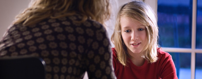 Young teen speaking with a counsellor