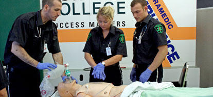 Durham College first year paramedics practicing on a test dummy