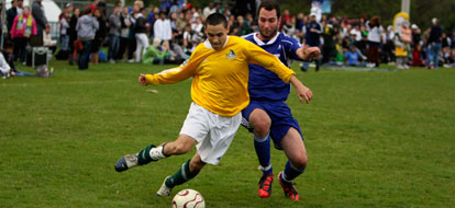 Durham College soccer player battling against a UOIT player in the annual campus cup