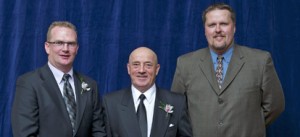 Vaso Vujanovic (centre), 2011 OCAA Hall of Fame inductee accepts his honour from Jay Shewfelt, OCAA president (left), and Ken Babcock, Durham College athletic director during the association's induction ceremony in May.